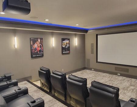 home theater installation with two rows of recliners in Fayetteville